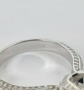 Silver ring with "14K" engraving inside band.