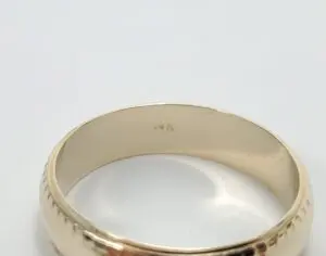 Gold ring with "14K" hallmark inside.