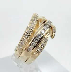 Gold ring with multiple diamond-studded bands.