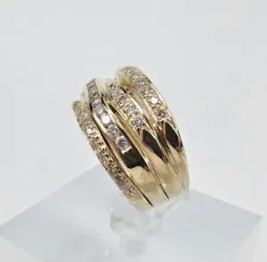 Gold ring with multiple diamond rows.