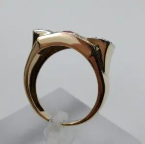 Gold ring with unique geometric design.