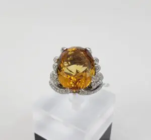 Gold gemstone ring with diamond accents.