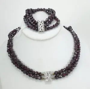 Garnet necklace and bracelet with silver clasps.
