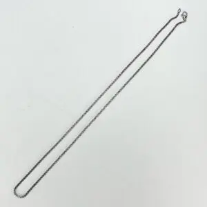 Silver chain necklace on white background.