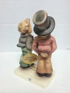Two figurines with a final issue tag.