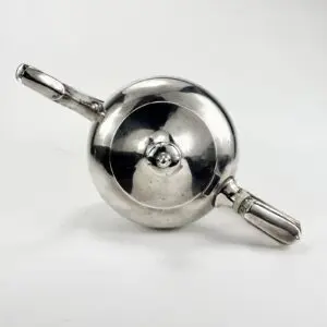 Silver teapot with two handles, top view.