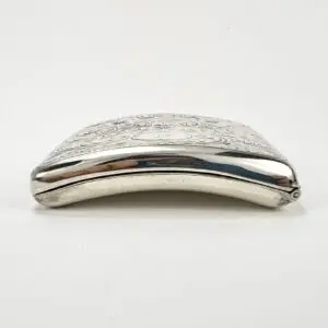 Ornate silver cigarette case on white background.