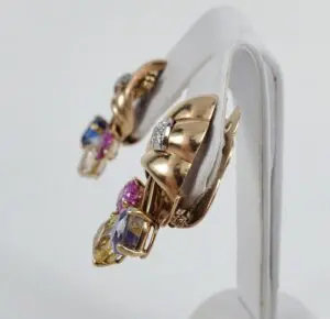 Gold earrings with colorful gemstone accents.