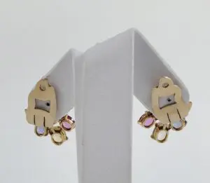 Gold earrings with colorful gem accents.