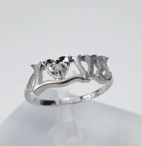 Silver ring with heart and "LOVE" design.