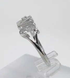 Silver ring with a unique, intricate design.
