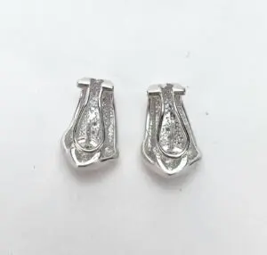 Silver clip-on earrings with diamond accents.
