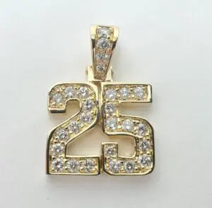 Gold pendant with diamond-studded number 25.