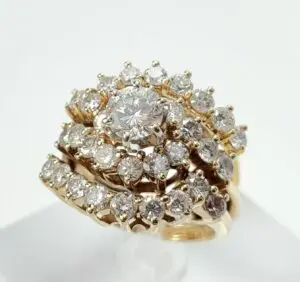 Gold ring with multiple sparkling diamonds.