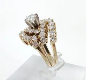 Gold diamond ring with intricate design.