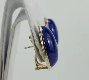 Gold hoop earrings with blue stone.