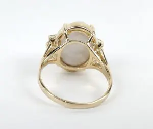 Gold ring with a large stone setting.
