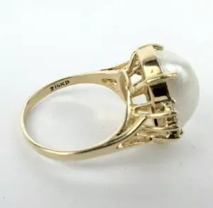 Gold ring with large pearl setting.