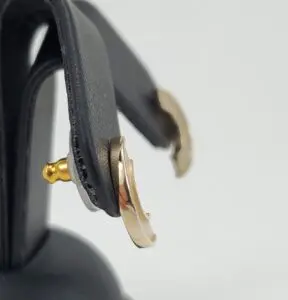 Gold and silver hoop earrings displayed.