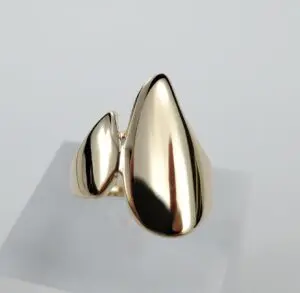 Gold abstract design ring on display.