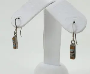 Rectangular earrings with geometric inlay design.
