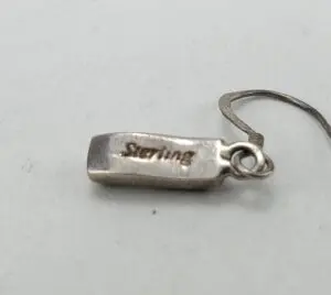 Sterling silver earring with hook attachment.