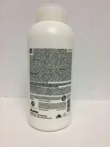 White bottle with black text label.