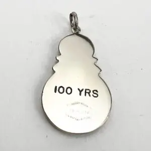 Snowman pendant with "100 YRS" inscription.