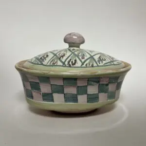 Decorative ceramic bowl with patterned lid.