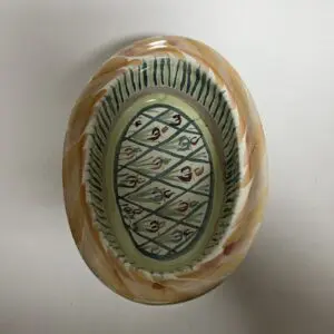 Decorative ceramic plate with intricate patterns.