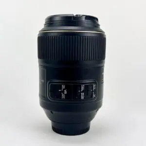 Camera lens with switches on white background.
