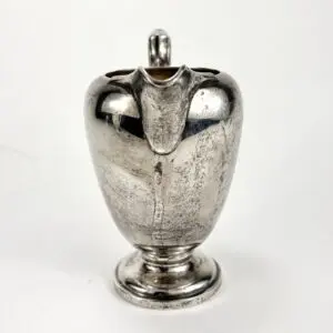 Silver-plated pitcher with a lid.