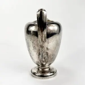 Silver vintage pitcher with handle.