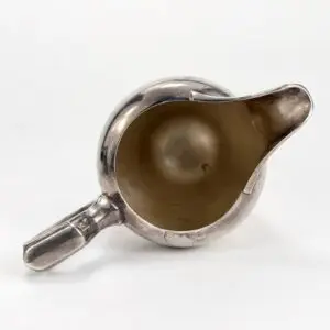 Metal pitcher viewed from above.