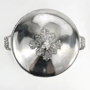 Silver dish with ornate floral design.