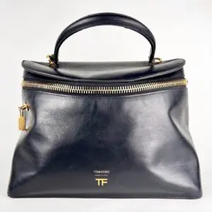 Black leather handbag with gold zipper.