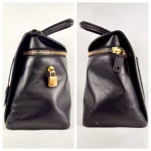 Black leather handbag with gold lock.