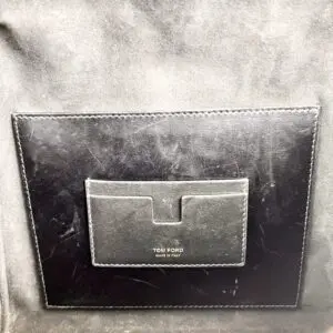 Black leather Tom Ford pocket interior label.