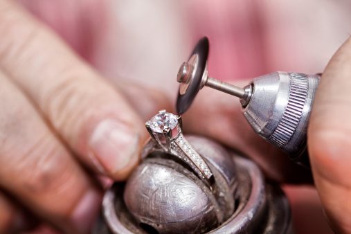 Jeweler Polishing A Diamond Ring