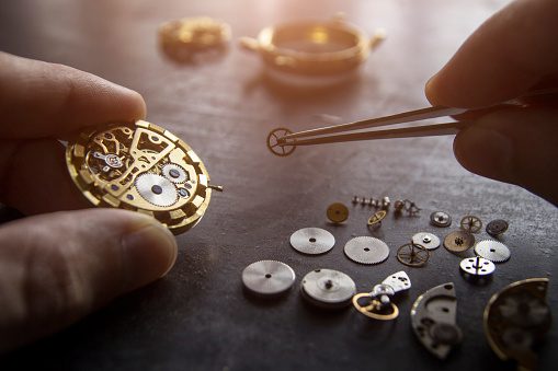 The Process Of Watch Repair With Many Watch Pieces