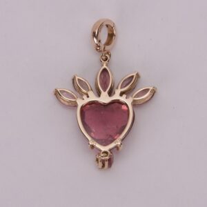 Heart-shaped red gemstone pendant design.