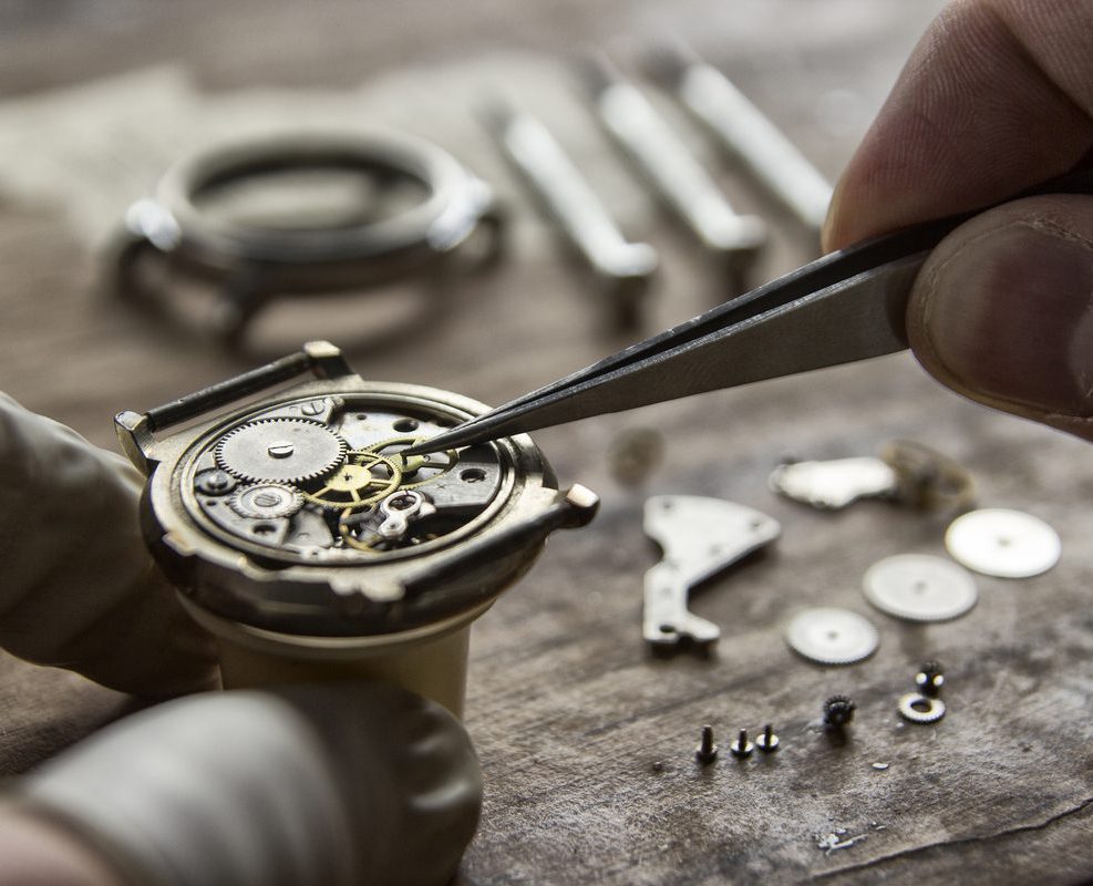 A person working on an old watch
