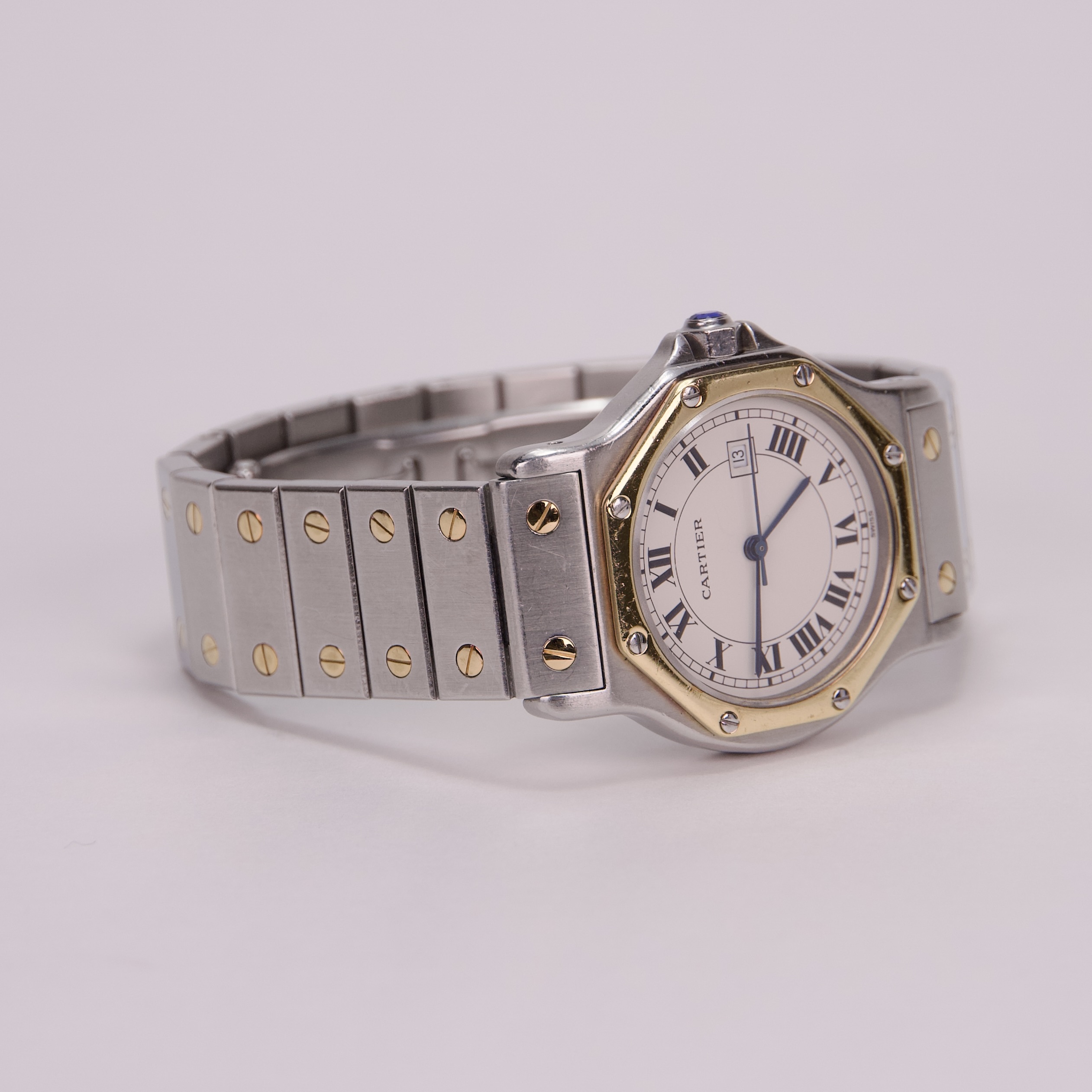 Luxury silver and gold wristwatch with date.