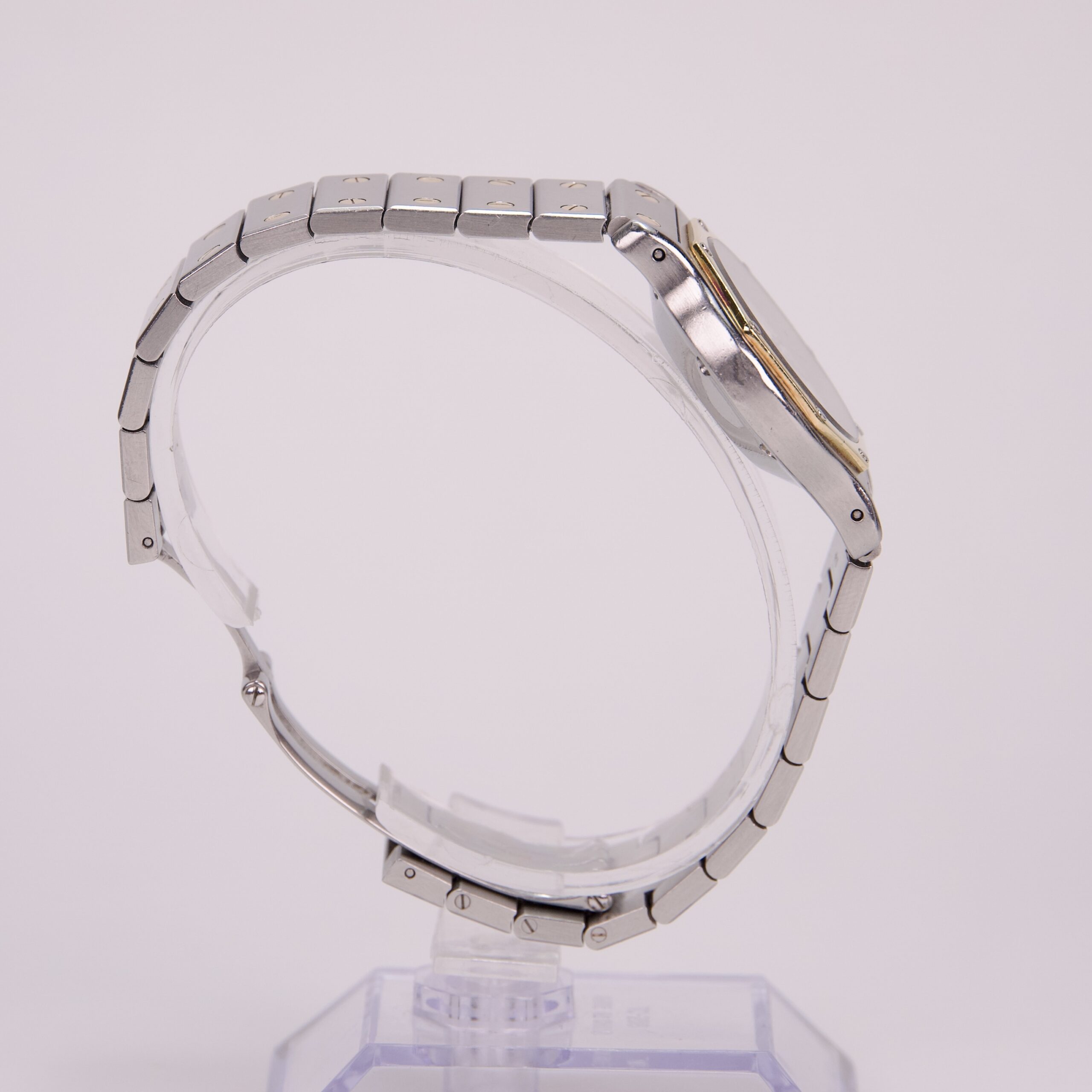Side view of a silver wristwatch.