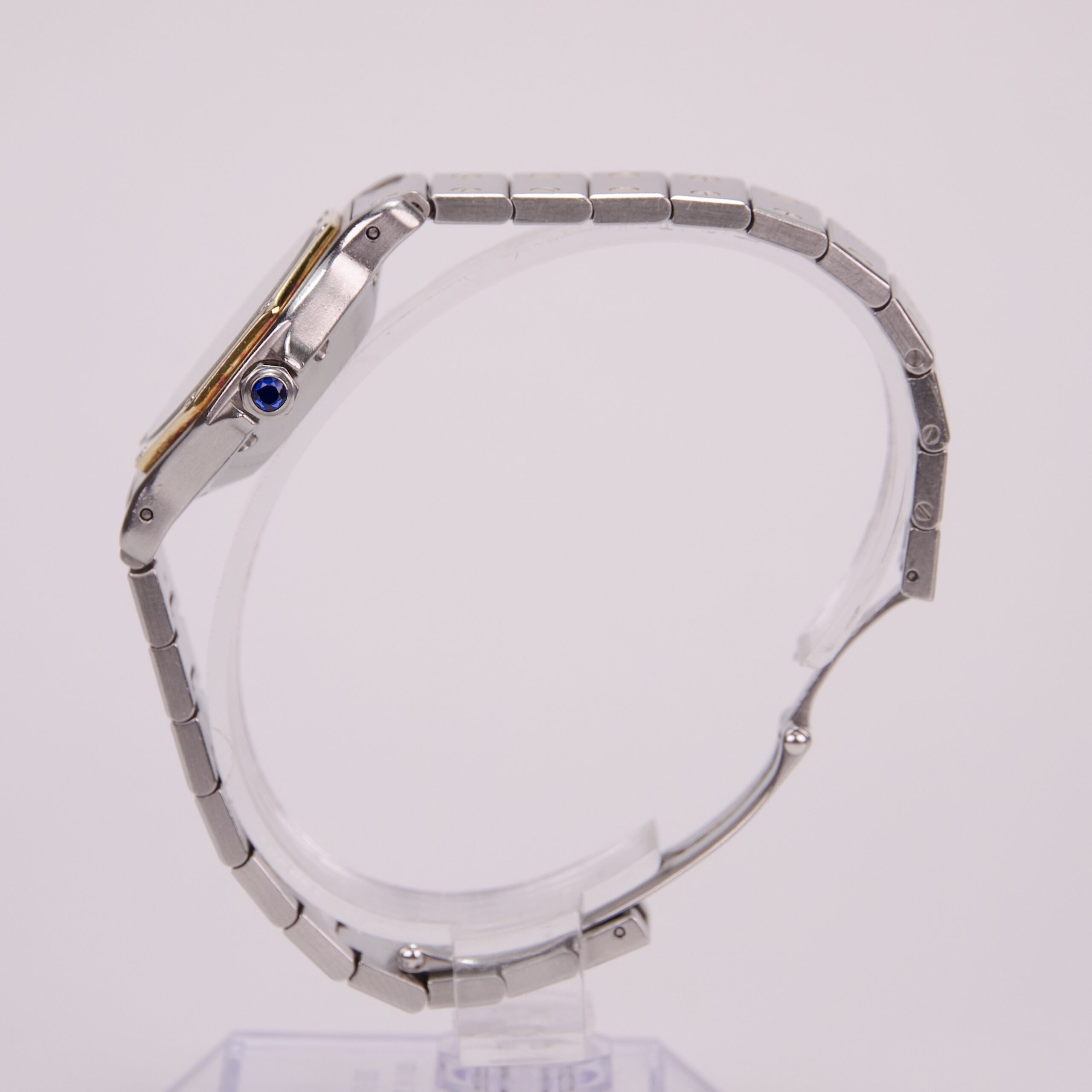 Silver wristwatch with blue crown detail.