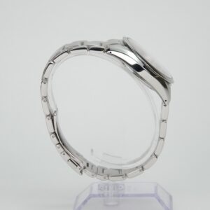Silver wristwatch on a clear stand.