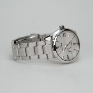 Silver wristwatch with metal bracelet.