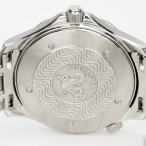 Back of a Seamaster watch with engravings.