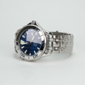 Silver wristwatch with blue dial.