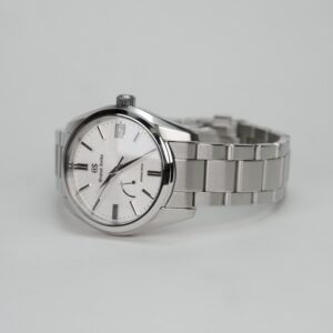 Silver wristwatch with metal bracelet band.